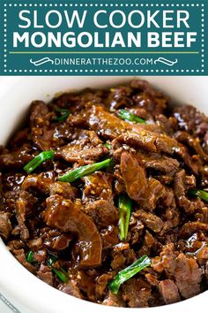 slow cooker beef with green onions in a white bowl