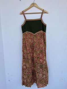 Bohemian cotton green floral printed long gown, block print maxi dress, cotton smocked dresses, strap outfits, cotton maxi, long maxi, green dresses, hand block print dress, smocking dress, comfortable dresses, summer dresses, beautiful gift for her, cutsom dress, indian dress, indian wholesaler, indian cotton dresses, strap dresses  Feel beautiful and confident throughout your days wearing our block printed outfits, made with high quality soft and breathable cotton fabric.  The print on the dre Festive Cotton Maxi Dress With Printed Motifs, Bohemian Maxi Dress With Bandhani Print, Bohemian Bandhani Print Maxi Dress, Green Cotton Dress With Kalamkari Print, Green Cotton Kalamkari Print Dress, Cotton Floor-length Maxi Dress For Festival, Green Floor-length Cotton Dress, Bohemian Cotton Maxi Dress With Batik Print, Green Bohemian Block Print Maxi Dress