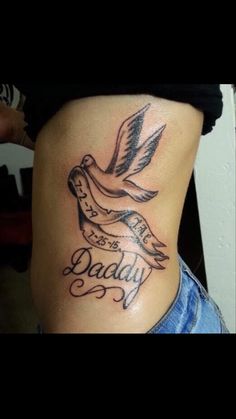 a woman with a tattoo on her stomach that says, daddy and an image of a dove