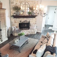 a living room filled with furniture and a fire place