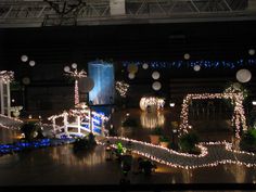 the interior of a building decorated with christmas lights