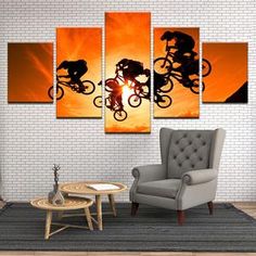 three people riding bicycles in the sunset on a bike trail wall art canvas painting print