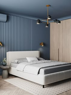 a bedroom with blue walls and white bedding in the center, along with an area rug on the floor