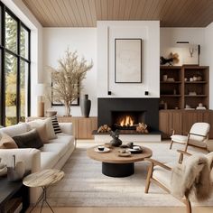 a living room filled with furniture and a fire place in the middle of the room