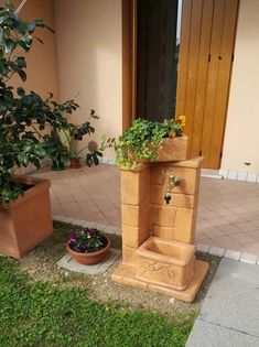 a planter that is on the ground next to a door