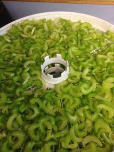 the green peppers are being prepared to be cut into smaller pieces and put in a bowl