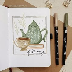 an open notebook with a drawing of a teapot and cup on it next to two markers