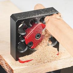 a person is using a tool to cut wood