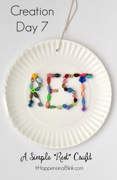 a paper plate with beads on it and the words creation day 7 written in small letters