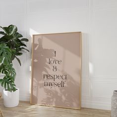 a poster with the words i love and respect in black on it next to a potted plant