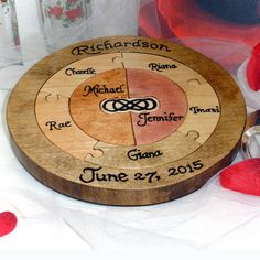 a personalized wooden cutting board with the names of their wedding rings and date on it