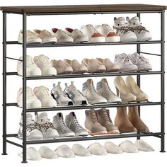 the shoe rack is filled with many pairs of shoes