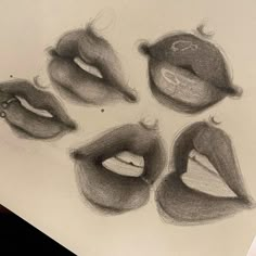 a pencil drawing of six different lips