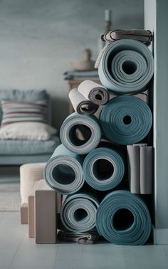 A minimalist home yoga studio with neatly organized yoga mats and equipment. Home Yoga Studio, Cozy Minimalist, Home Yoga, Ways To Organize