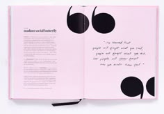 an open pink book with black dots on the pages and a poem written in it