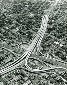 an aerial view of freeways and roads in the city