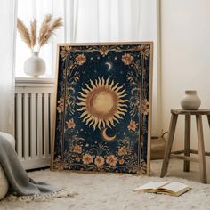 the sun and moon tapestry is on display in front of an open radiator