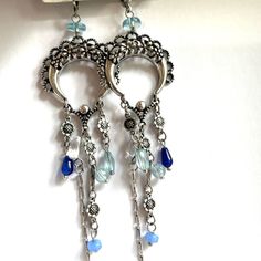 Measurements- Please See Photo. Blue Metal Earrings With Dangling Beads, Blue Sterling Silver Chandelier Earrings With Ear Wire, Blue Drop Earrings With Dangling Charms, Blue Metal Chandelier Earrings With Dangling Beads, Blue Bohemian Sterling Silver Earrings, Blue Nickel-free Dangle Chandelier Earrings, Blue Metal Chandelier Earrings With Ear Wire, Blue Bohemian Crystal Earrings, Bohemian Blue Crystal Earrings