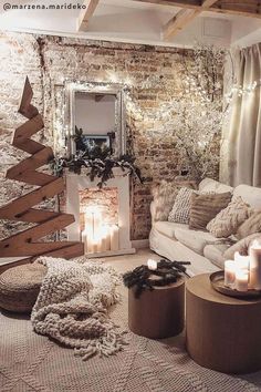 a living room filled with lots of furniture and candles on top of the floor next to a fire place