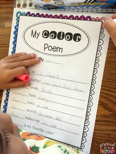 a child is writing on a paper with the words my color poem written in it