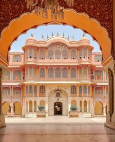 an archway leading into a building with ornate architecture