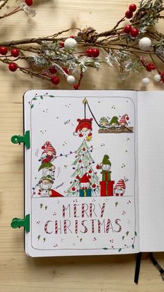 an open christmas notebook on top of a wooden table