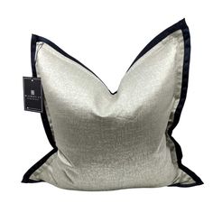 a silver and black pillow with a tag on the side that says,'i love you