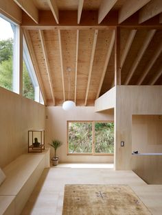 the interior of a house with wooden walls and ceilings