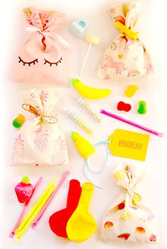 various toys and accessories are laid out on a white surface with the words hooray written below them