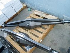 two large metal objects sitting on top of wooden pallets