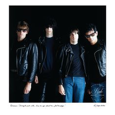 four men in black leather jackets and sunglasses