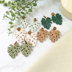 These summer inspired monstera leaf earrings a delightful accessory that brings a touch of nature-inspired charm to any ensemble. Crafted with love and attention to detail, they showcase a whimsical and playful design that is sure to put a smile on your face. The earrings feature bright, summery monstera leaves made from polymer clay.  The charming beauty of these leaf earrings lies in their versatility. Whether you're attending a beachside party, a casual outing with friends, or simply want to Monstera Leaf Polymer Clay Earrings, Trendy Leaf-shaped Earrings For Gifts, Green Nature-inspired Everyday Earrings, Everyday Green Nature-inspired Earrings, Nature-inspired Leaf Earrings For Everyday, Trendy Handmade Leaf-shaped Earrings, Monstera Leaf Earrings, Resin Clay, Earrings Summer