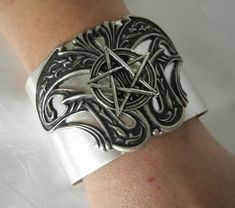 "Pentacle Cuff Bracelet This beautiful silver plated cuff bracelet has a silver plated design and a pewter silver pentacle. Adjustable. 2\" wide." Dragons Breath Fire Opal, Witch Pentagram, Wicca Jewelry, Goddess Bracelet, Wiccan Decor, Gothic Bracelet, Gothic Witch, Jewelry Gothic, Goddess Jewelry