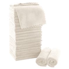 a stack of white towels next to each other