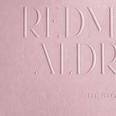 a pink book with the words redmond aldre written in white on it's cover