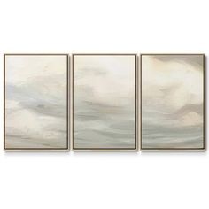 three abstract paintings on a white wall with grey and beige colors, one in the foreground