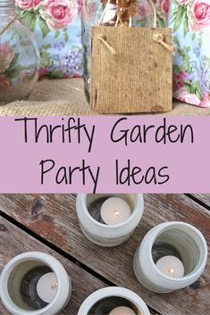 three mason jars filled with candles sitting on top of a wooden table next to flowers