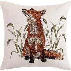 a white pillow with a red fox on it