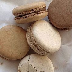 four macaroons are sitting next to each other