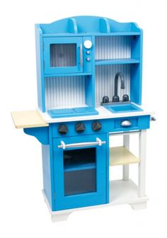 a toy kitchen with blue cabinets and white counter tops, including an oven and sink