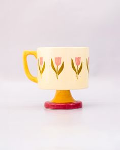 side view of top view of cream 10 oz ceramic mug with yellow handle, pink pedestal base and pink tulip print Pretty Ceramic Mugs, Ceramic Painted Mug, Tulip Mug, Clay Techniques, Colorful Pottery, Color Me Mine, Tulip Painting, Choppy Bob, Floral Mug