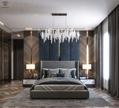 a bedroom with a large bed and chandelier