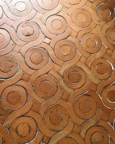 a close up view of a tile floor with circles on it