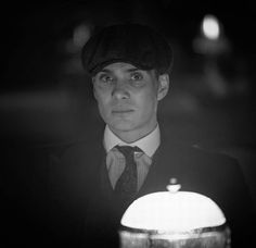 black and white photograph of a man wearing a hat