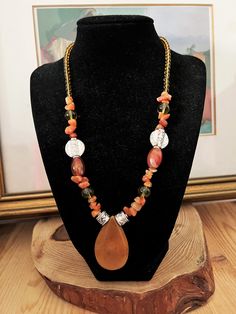 "Orange Aventurine and Peridot Agate Antique Style Coin Necklace. Israel Agate Necklace. Glamrox Necklace Orange Agate Drop Pendant Artisan This is a stunning necklace featuring a large orange aventurine drop pendant with silver coin antique style enhancers and mixed stones of peridot and agate! Beautiful color combo Pendant measures: 1.75 x 1 1/8 designed by Glamrox :-) a beautiful combo! *If you have have any questions regarding this item, please hit the \"Ask a Question\" button next to the p Agate Necklace Diy, Orange Aventurine, Necklace Orange, Orange Agate, Pretty Jewelry, Agate Necklace, Silver Coin, Coin Necklace, Stunning Necklace