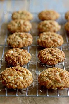 some cookies are cooling on a rack and ready to go into the oven for baking