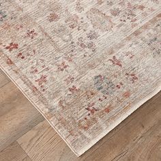 an area rug with wooden floors and wood flooring on top of it, in the middle