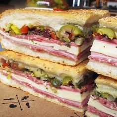 four sandwiches stacked on top of each other