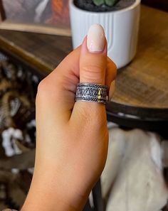 Handcrafted with care and stamped with intricate designs on aluminum, this ring showcases unique craftsmanship while adding a touch of western to any outfit. Wrap around stamped design Aluminum Adjustable fit for many sizes Wide band Handcrafted in the United States Intricate Designs, Wide Bands, Wrap Around, The United States, United States, Stamp, Band, Ring, Design