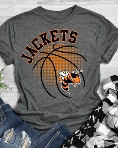 Looking for a unique way to show off your love for the BASKETBALL? Look no further than our BASKETBALL DTF Transfer! This transfer is perfect for adding a touch of personality to your t-shirts, bags or anything else that needs a bit of customization. Our transfer is made with high-quality direct to film technology, making it durable and long-lasting. Whether you're looking to show off your love for your favorite team or add a little flair to your clothing, our BASKETBALL DTF Transfer is the perfect choice. Our transfer is easy to apply, making it a great choice for anyone looking to create custom t-shirts or other items. Simply use a heat press to apply the transfer to your chosen fabric. At Rustic Grace, we're committed to providing high-quality, affordable heat transfer designs and heat Team Tshirt Design Ideas, Baseball Spirit Wear, Basketball Shirts Designs, Basketball Shirts For Players, Spartan Images, High School Shirt Designs, Basketball Shirt Ideas, Basketball Team Shirts, Boys Activities